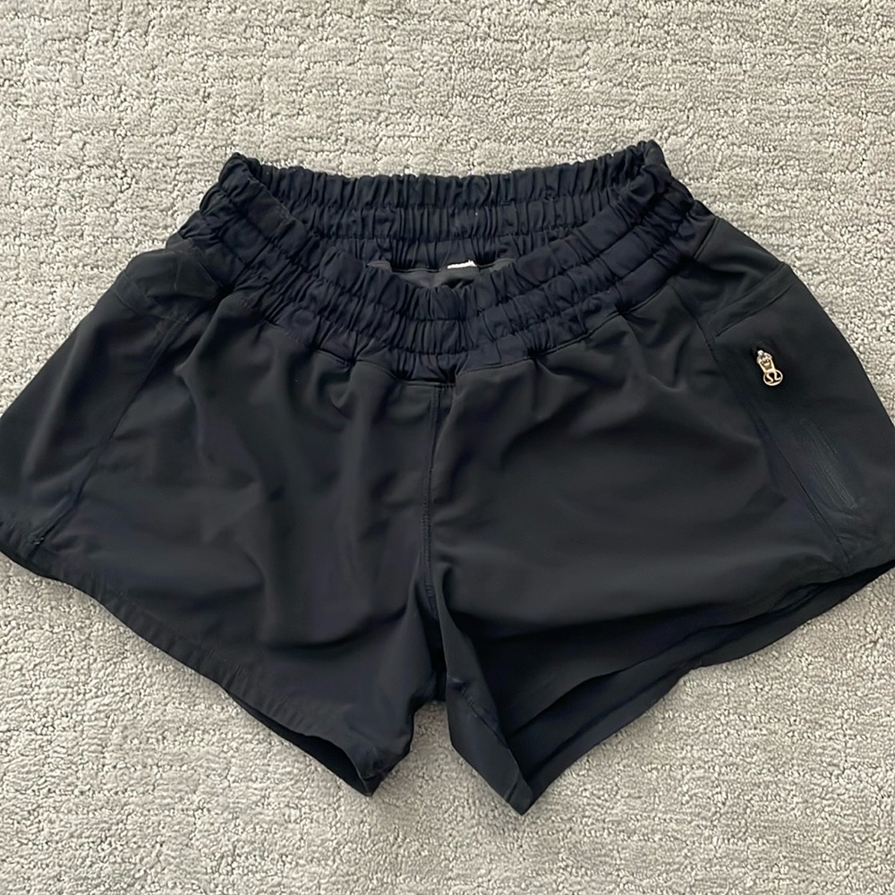 Gently used Lululemon black tracker run shorts, size 4